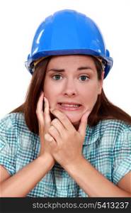 Indecisive woman in a hardhat