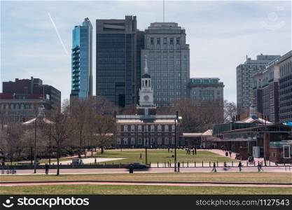 Independence Hall at afternoon time which have Pedestrian and tourist walking around in Philadelphia, Pennsylvania, United States of America, USA, History and culture of big town concept