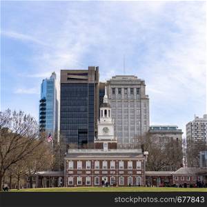 Independence Hall in Philadelphia Pennsylvania USA with Philadelphia cityscape skyline building in Background.