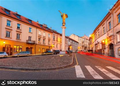 Independent republic Uzupis in Vilnius, Lithuania.. Uzupis Angel, statue of an angel blowing a trumpet in the main square, symbol quarter of an independent republic Uzupis, during evening blue hour, Vilnius, Lithuania, Baltic states.