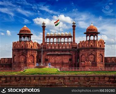 India famous travel tourist landmark and symbol - Red Fort  Lal Qila  Delhi with Indian flag - World Heritage Site. Delhi, India. Red Fort Lal Qila with Indian flag. Delhi, India