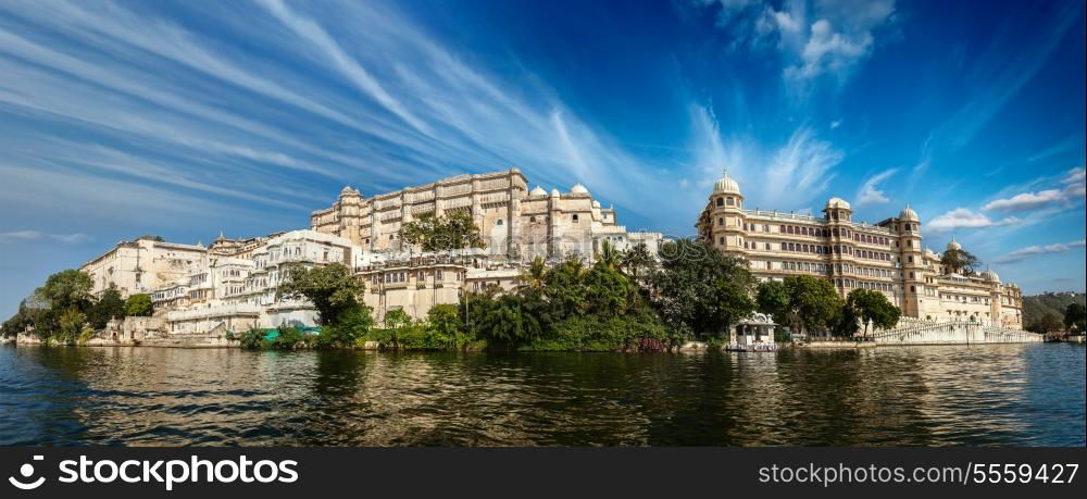 India luxury tourism concept background - panorama of Udaipur City Palace from Lake Pichola. Udaipur, India