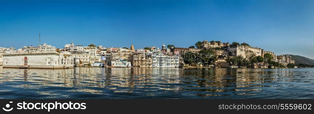 India luxury tourism concept background - panorama of Udaipur City Palace from Lake Pichola. Udaipur, India