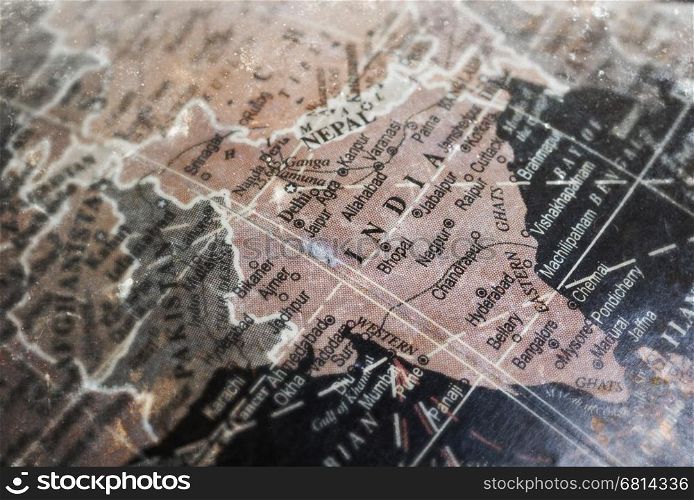 India map on vintage crack paper background, selective focus