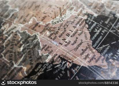 India map on vintage crack paper background, selective focus