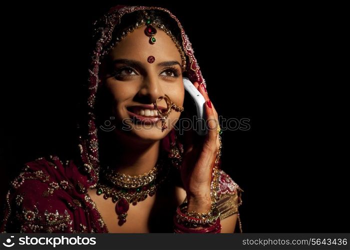 Indian bride talking on a mobile phone