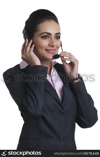 Indian businesswoman wearing headset over white background