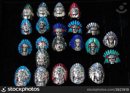 Indian Chief shaped silver rings arranged side by side