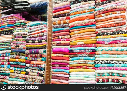 Indian colored clothes on the shelves of a store in Dubai