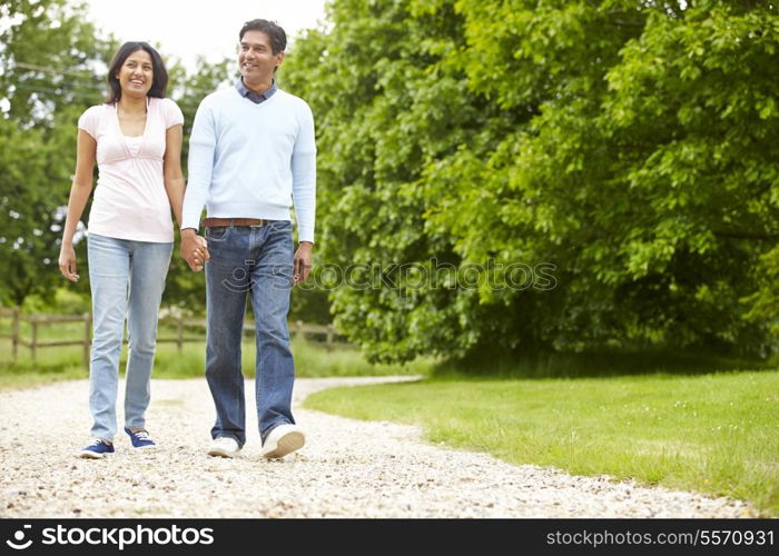 Indian Couple Walking In Countryside