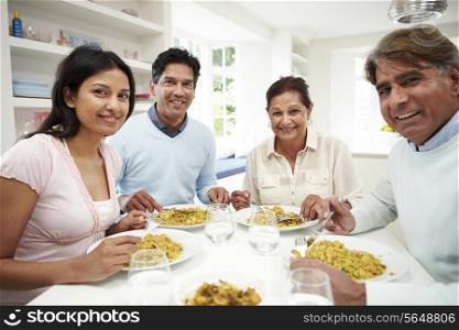 Indian Family Eating Meal At Home
