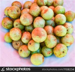 Indian gooseberry on plate background / Fruit of herbs and medicinal