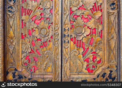 Indian inspired carved coloful golden red wooden door