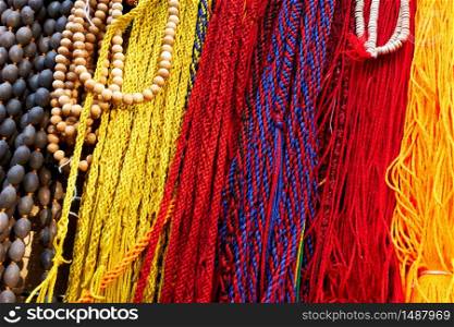 Indian laces of different colors and beads at market - Motley ethnic background