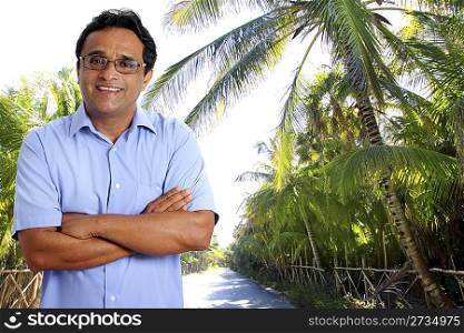 Indian latin tourist man in tropical palm tree caribbean track