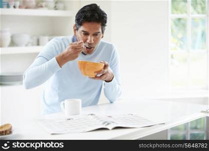 Indian Man Enjoying Breakfast At Home