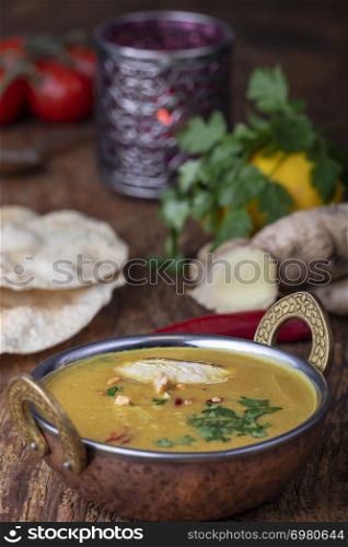 indian Mulligatawny soup in a brass bowl