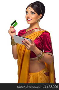 Indian woman with plastic card and tablet PC isolated