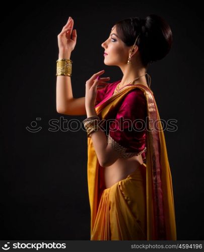 Indian young woman on black