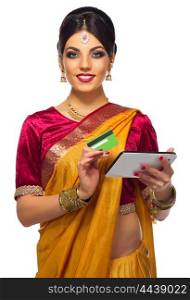 Indian young woman plastic card and tablet PC isolated