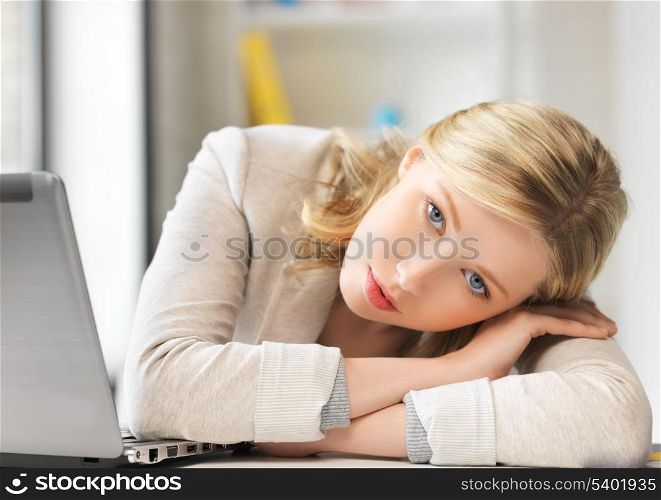 indoor picture of bored and tired woman behind the table