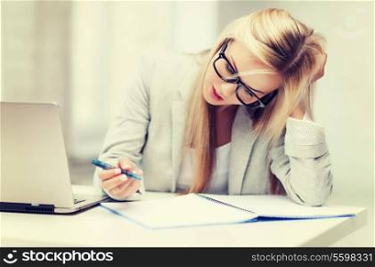 indoor picture of bored and tired woman taking notes