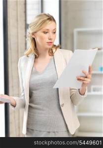 indoor picture of calm woman with documents