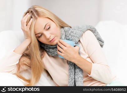 indoor picture of diseased woman with cup of tea