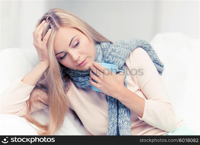 indoor picture of diseased woman with cup of tea. diseased woman with cup of tea