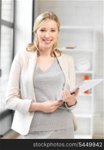 indoor picture of happy woman with documents