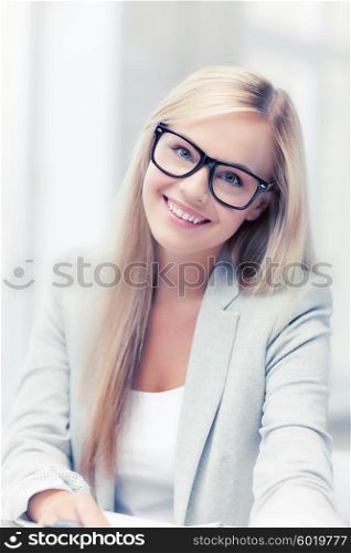 indoor picture of smiling woman with eyeglasses. businesswoman with glasses