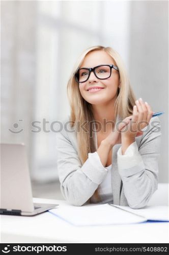 indoor picture of smiling woman with notebook and pen