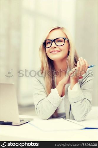 indoor picture of smiling woman with notebook and pen