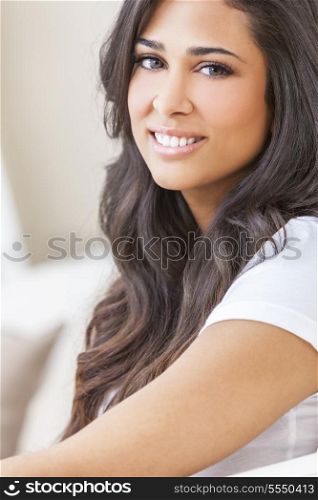 Indoor portrait of a beautiful young Latina Hispanic woman smiling