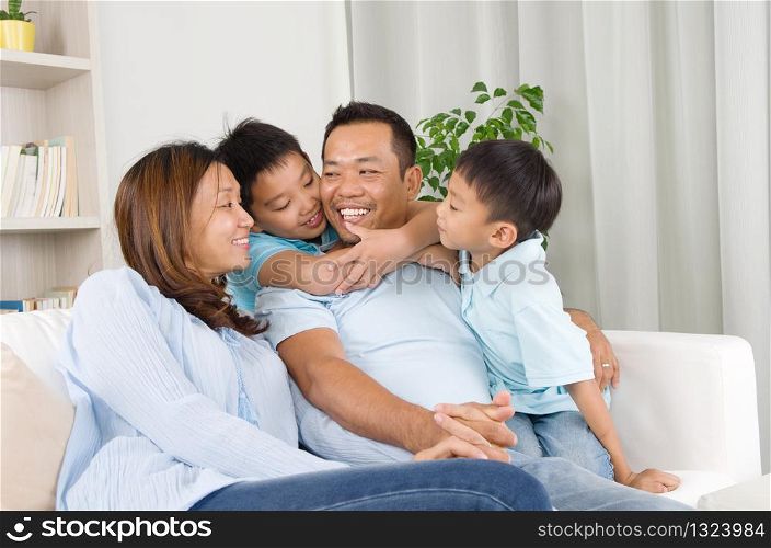 Indoor portrait of asian family