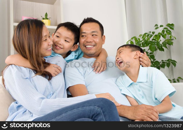 Indoor portrait of asian family