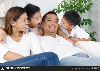 Indoor portrait of asian family