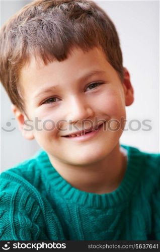 Indoor Portrait Of Boy Wearing Jumper