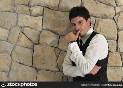 Indoor portrait of young and happy businessman