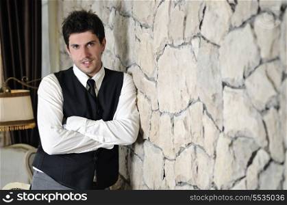 indoor portrait of young and happy businessman