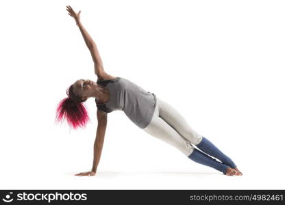 Indoor shot of african young woman doing yoga isolated on white background