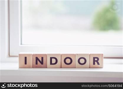 Indoor sign made of wooden cubes in a bright room