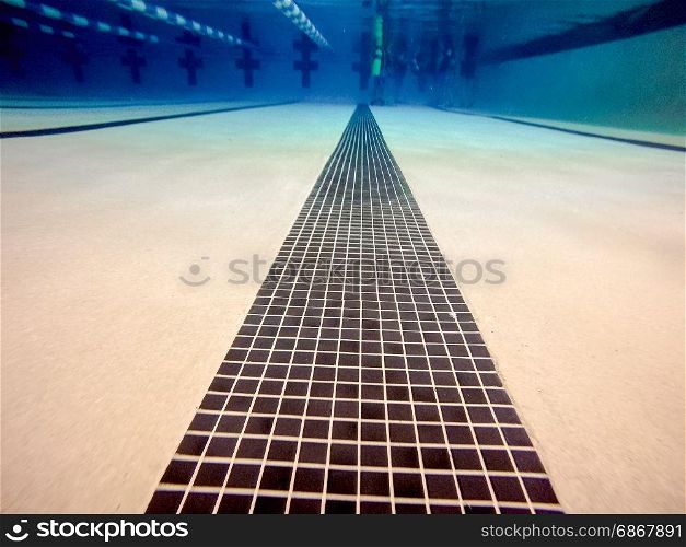 indoor swimming pool above and under water