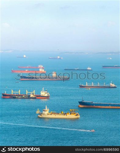 Industrial cargo shipping tankers in Singapore harbor