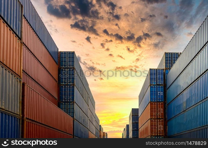 Industrial container yard for business commercial trade logistic transportation oversea worldwide Import Export, Stack of colorful cargo freight ship container at sunset background.