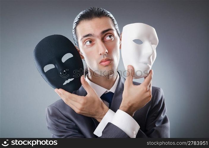 Industrial espionate concept with masked businessman