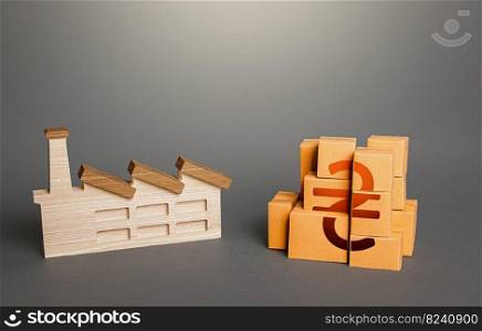 Industrial factory and ukrainian hryvnia product boxes. National economy, domestic production of goods. Logistic transportation. Support manufactures. Investment in expansion of production.