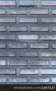 Industrial grey brick wall vertical background