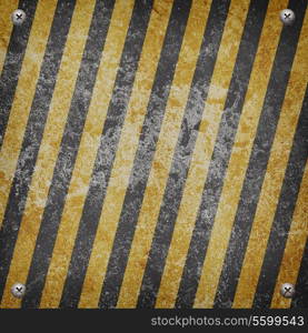 Industrial grungy steel plate with black and yellow strip