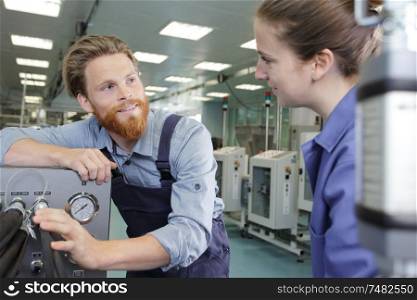 industrial man and woman engineer in factory
